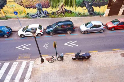 a group of cars parked on the side of a street at A studio-apartment in a newly built house.WIFI in Valencia