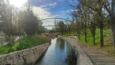 a view of a river with a bridge in the background at Non Stress Turia in Valencia