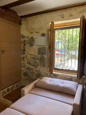 a living room with a couch and a window at Apartamento Rural Piedra in Jérica