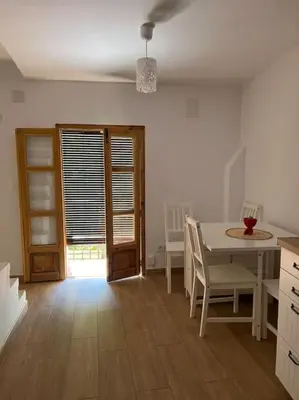 a kitchen and dining room with a table and chairs at Apto. Rural Cielo. Al lado Torre in Jérica