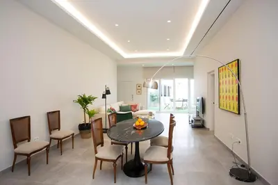 a living room with a table and chairs at SingularStays Picaña in Picanya