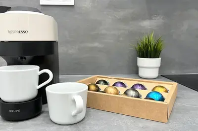a box of easter eggs on a counter next to cups at Apartamento nuevo cerca de la playa y céntrico in Valencia