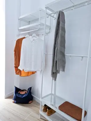 a closet with a white shelf and clothes at Apartamento nuevo cerca de la playa y céntrico in Valencia