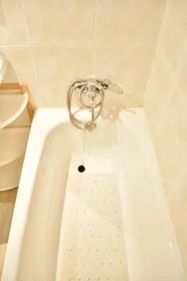 a white bath tub in a bathroom with a sink at Estudio con encanto en el casco antiguo de Valencia in Valencia