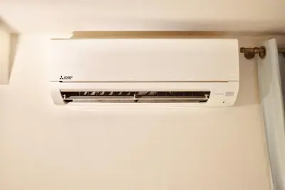 a refrigerator with a air conditioner on top of it at Estudio con encanto en el casco antiguo de Valencia in Valencia