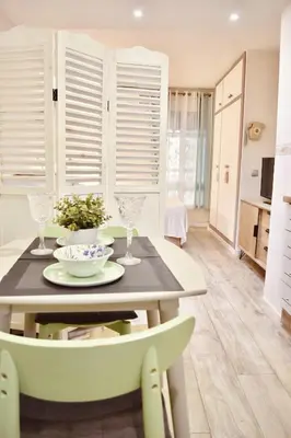 a dining room with a table and chairs at Estudio con encanto en el casco antiguo de Valencia in Valencia