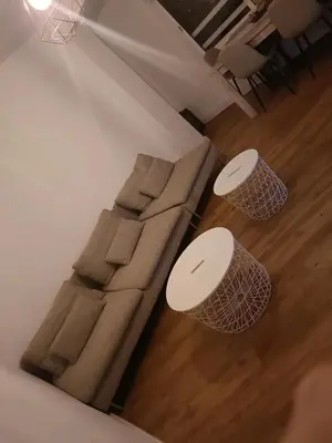 a living room with a couch and two tables at vip rooms patraix in Valencia