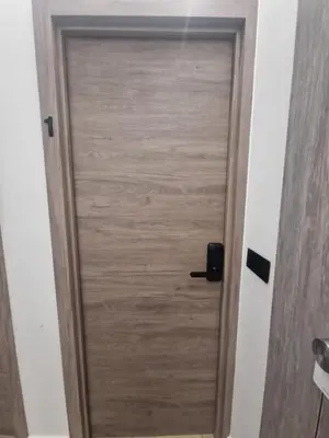 a wooden door in a room at Habitación céntrica de Lujo Gv 1 in Valencia