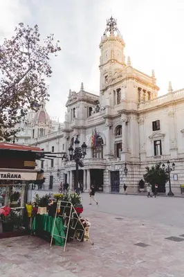 a large building with a clock tower in front of it at Habitación céntrica de Lujo Gv 1 in Valencia