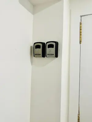 two clocks on a wall in a room at Piso Lorena Playa 1min walk in Puerto de Sagunto