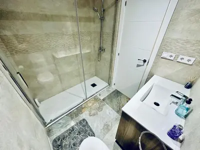a bathroom with a shower and a sink at Piso Lorena Playa 1min walk in Puerto de Sagunto