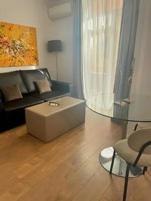 a living room with a couch and a coffee table at Valencia Bella Flats in Valencia