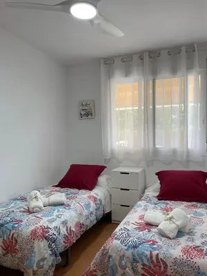 a bedroom with two beds with stuffed animals on them at APARTAMENTO PLANTA BAJA CANET DE BERENGUER in Canet de Berenguer