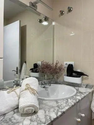 a bathroom with a sink and a mirror at APARTAMENTO PLANTA BAJA CANET DE BERENGUER in Canet de Berenguer