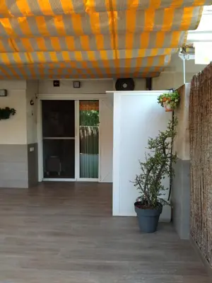 an office lobby with an orange and yellow ceiling at APARTAMENTO PLANTA BAJA CANET DE BERENGUER in Canet de Berenguer