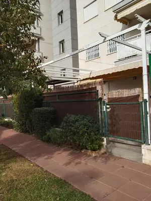 a building with a gate in front of a house at APARTAMENTO PLANTA BAJA CANET DE BERENGUER in Canet de Berenguer