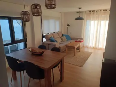 a living room with a table and a couch at Casa Rural Judith in Segorbe