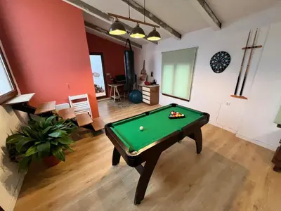 a living room with a pool table in it at Casa Rural Judith in Segorbe