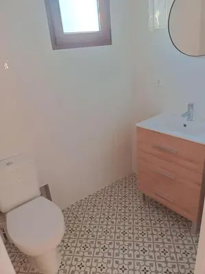 a bathroom with a toilet and a sink at Casa Rural Judith in Segorbe
