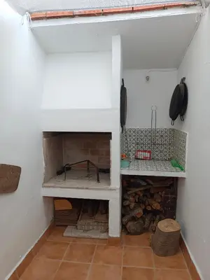 a room with a brick fireplace in a room at Casa Rural Judith in Segorbe