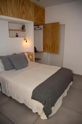 a bedroom with a large white bed with gray pillows at lifecoliving valencia loft B in Valencia