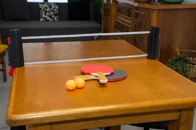 a table with a tennis racket and balls on it at lifecoliving valencia loft B in Valencia