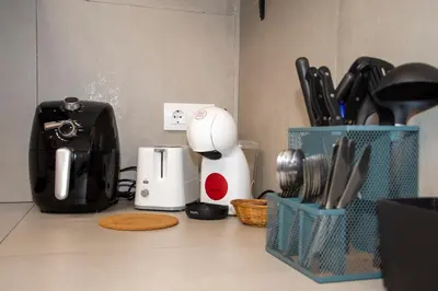 a kitchen counter with a counter top with utensils at lifecoliving valencia loft B in Valencia