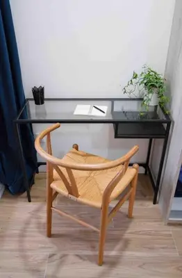 a desk with a chair in front of a desk with a plant at Studio chic avec terrasse, lumineux et calme 1 in Valencia