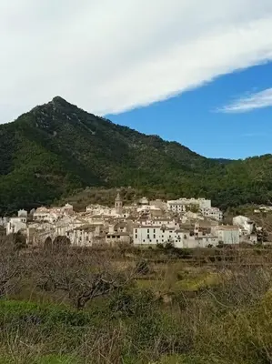 a group of white buildings on a mountain at Casa Rural Ana Maria Ain in Ahín