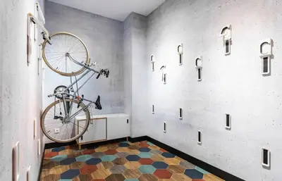 a bike is hanging on a wall in a room at REINA FLATS VALENCIA Playa in Valencia