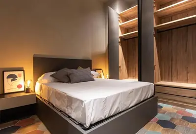 a bedroom with a large white bed in a room at REINA FLATS VALENCIA Playa in Valencia