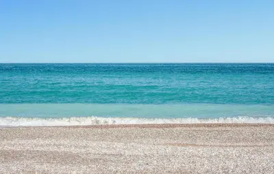 a sandy beach with the ocean in the background at Awesome Apartment In Moncofa in Moncófar