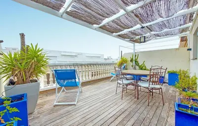 a patio with a table and chairs on a deck at Awesome Apartment In Moncofa in Moncófar
