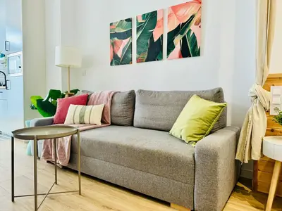 a living room with a couch and a table at Nice & Cozy Flat Close The Beach in Valencia