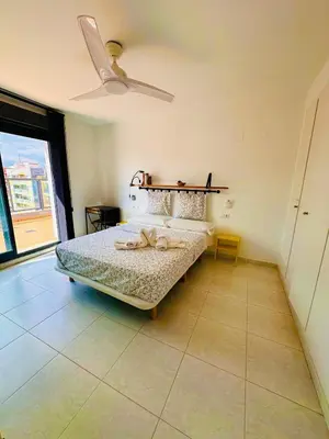a bedroom with a bed and a ceiling fan at Attic terrace 360 Moncofa in Moncófar