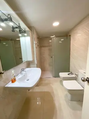 a bathroom with a sink and a toilet and a shower at Apartamento familiar Port-Saplaya in Port Saplaya