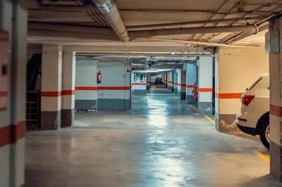 an empty parking garage with cars parked in it at Apartamento familiar Port-Saplaya in Port Saplaya