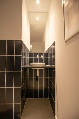 a bathroom with a sink and a mirror at Breathe Apartments by Concept Flats in Valencia
