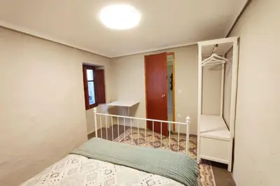 a small bedroom with a bed and a closet at District Key - Lliria, Santisima Sangre in Lliria