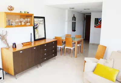 a living room with a couch and a dining room at Valencia las Artes y Ciencias + Garaje + Netflix in Valencia