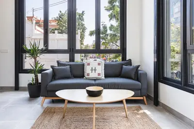 a living room with a couch and a table at Valencia Apartments by Olala Homes in Valencia