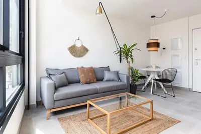 a living room with a couch and a table at Valencia Apartments by Olala Homes in Valencia