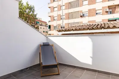 a easel on a balcony with a building at Valencia Apartments by Olala Homes in Valencia