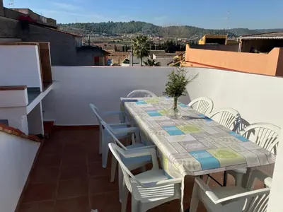 a table and chairs sitting on a balcony at CAN´SELMA 1 in Chella