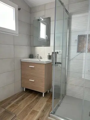 a bathroom with a sink and a glass shower at CAN´SELMA 1 in Chella