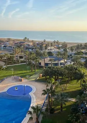 an aerial view of a resort with a swimming pool and the ocean at Apto con vistas a la playa de La Patacona in Valencia