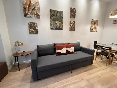 a living room with a couch and a table at Mestalla Garden in Valencia