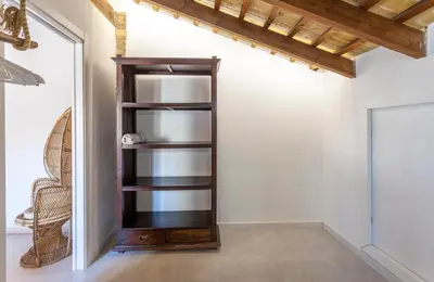 a room with a book shelf next to a door at Mediterranean Gem Getaway in Valencia