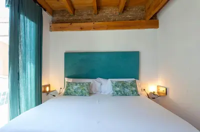 a bedroom with a large white bed with two pillows at Mediterranean Gem Getaway in Valencia