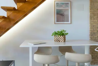 a white table and chairs with a plant on it at Mediterranean Gem Getaway in Valencia